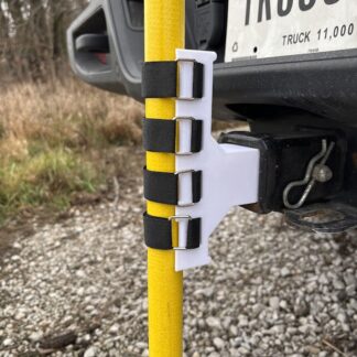 White 3D-printed hitch mast mount holding a yellow fiberglass mast on a truck receiver